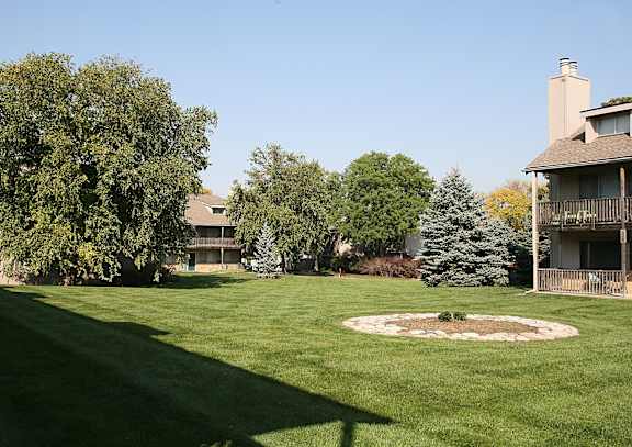 A wide view of the Eden West Apartments Complex, showcasing the buildings and surrounding landscape.