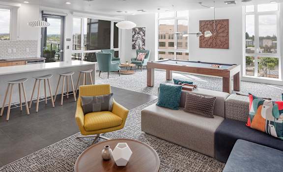 Arc Central Apartments Community Room with Seating and Pool Table