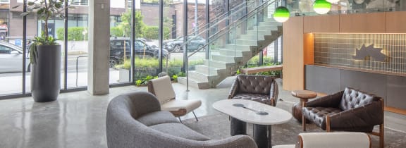 a seating area with chairs and tables in a lobby