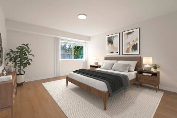 A bedroom with a large bed, a nightstand, and a plant.