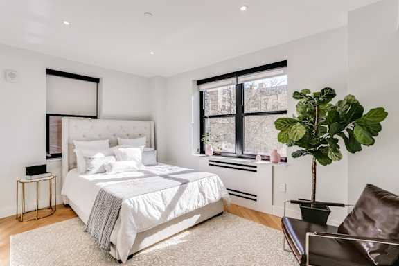 Sun filled one bedroom apartment with hardwood floors and custom closets