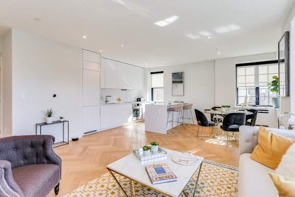 Open concept living and dining rooms with brand new hardwood flooring