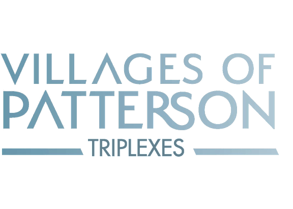 A green sign with white text that reads "Villages of Patterson Triplexes".