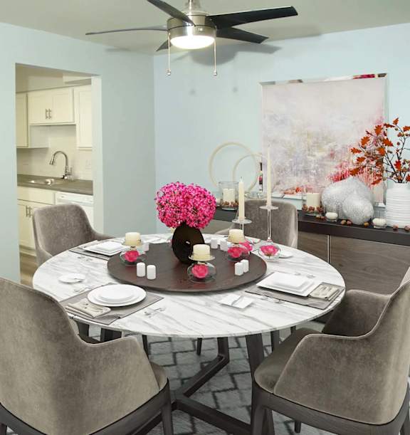 A dining room with a table and chairs.