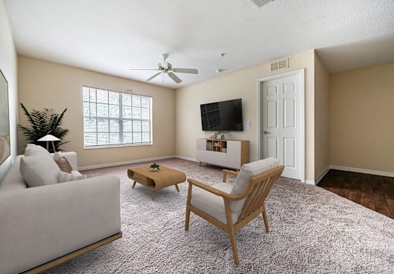 A living room with a couch, chair, and television.
