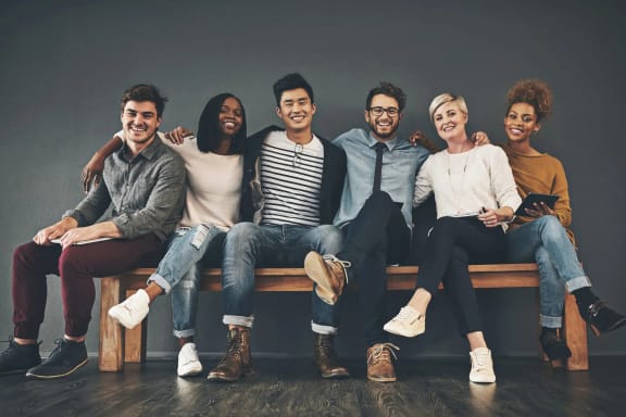 a group of people sitting on a bench