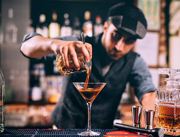 a bartender making a cocktail  at The Griffin Royal Oak, Royal Oak, Michigan