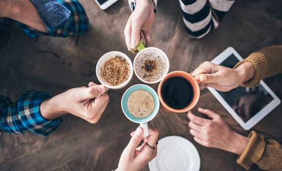 a group of people sitting around a table drinking coffee at Arterra, Albuquerque, New Mexico, 87113