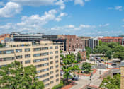Thumbnail 16 of 20 - an aerial view of a city street with buildings and trees