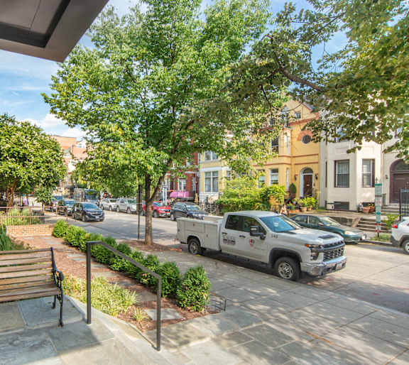 A white truck is parked on the street.