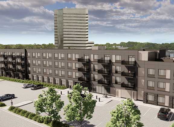 a rendering of a large apartment building in a parking lot