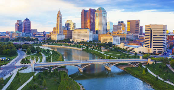 a view of the city with a river and a bridge