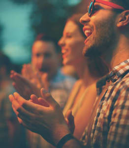 People singing along with one another