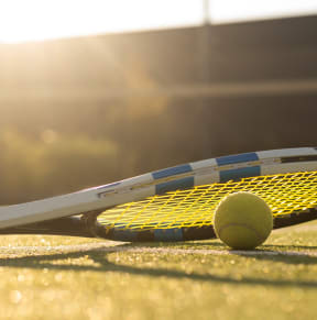 Tennis racket and tennis ball on a court at South Pine, Union City, GA, Georgia , 30291