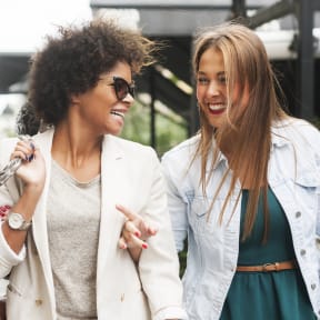 a group of women walking down the street
