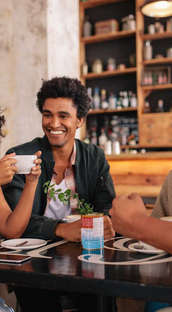 Two women enjoying a meal together at a restaurant.