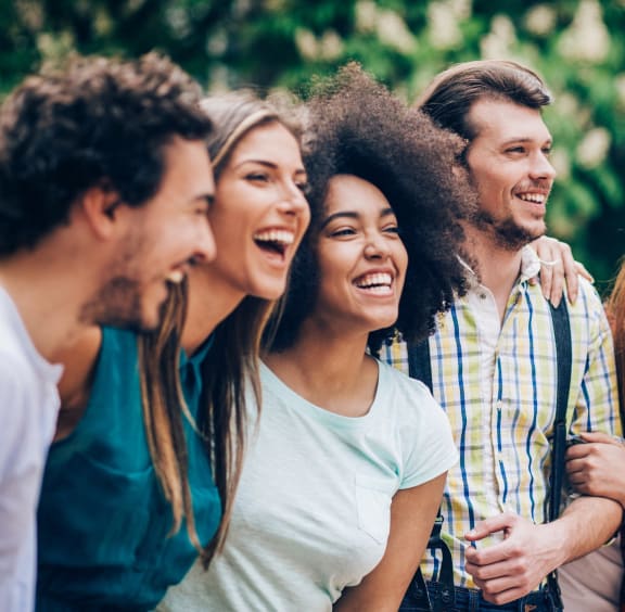 a group of young people laughing together