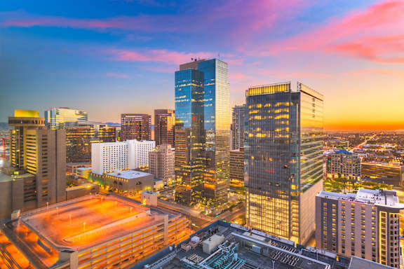 A Cityscape at Sunset with a Variety of Buildings at The Rey Downtown Apartments, Phoenix
