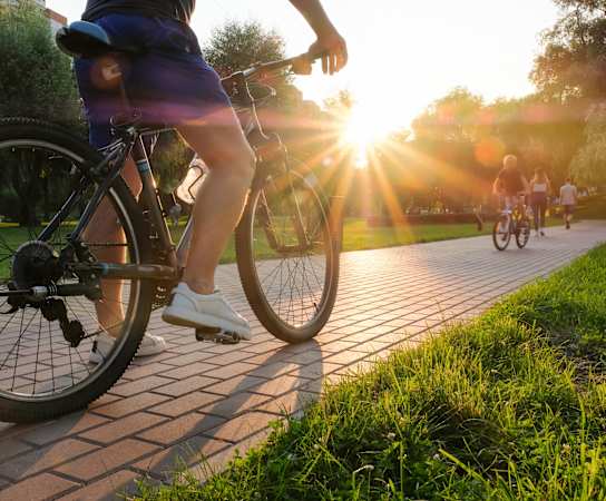 Man rides bike at Vineyard Terrace Apartments, Napa