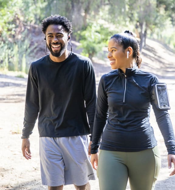 a man and a woman walking down a dirt road at Urban Crest Apartments, Texas, 78209