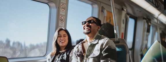 Man and a woman are sitting in a metro at Falkland Chase, Silver Spring, Maryland