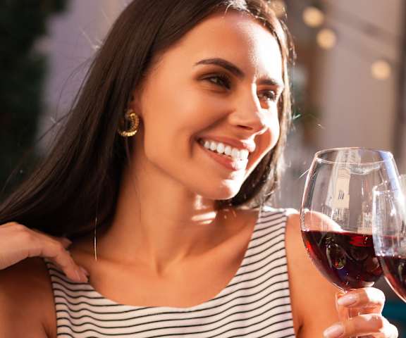 man and woman enjoying dinner and a glass of wine in Gulfport, Mississippi