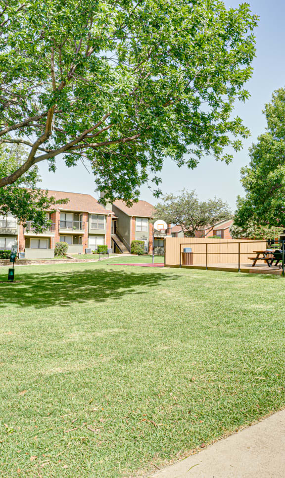 our apartments offer a spacious courtyard with grass and trees