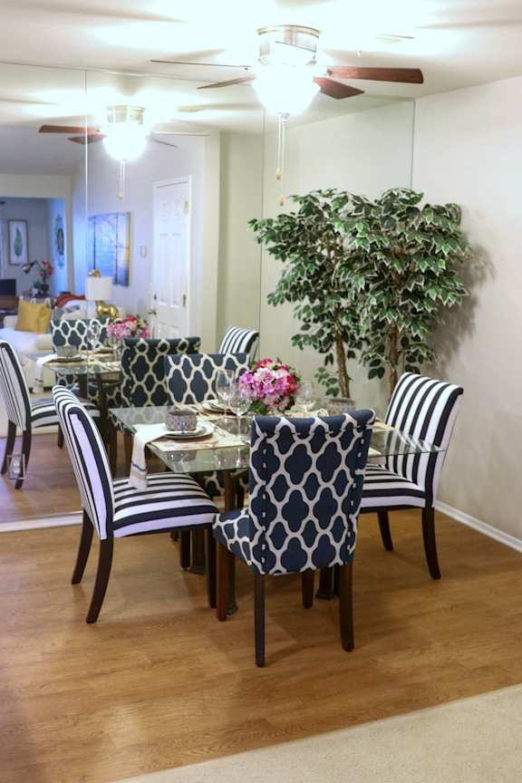 how to decorate a dining room with a table and chairs at Village Club on Franklin, Southfield, MI