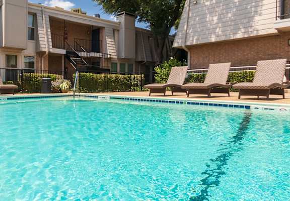 This is a photo of the pool area at Woodbridge Apartments in Dallas, Texas.