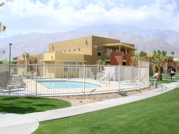 Outdoor swimming pool area and apartment building exterior