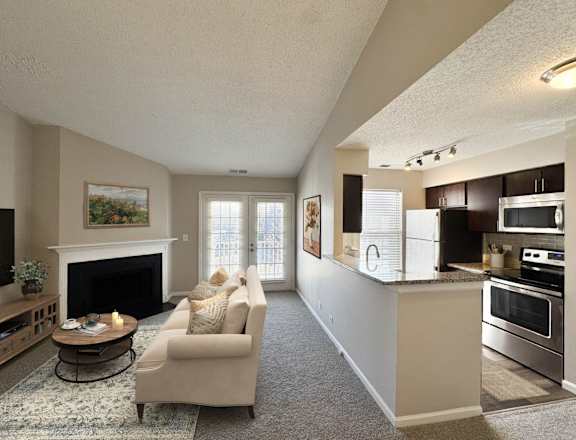 A living room with a fireplace and a couch.