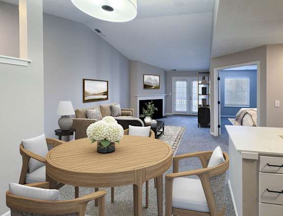 A living room with a wooden table and chairs.