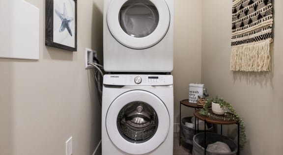 a washing machine and dryer in a laundry room