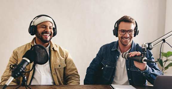 two men podcasting in a recording studio with microphones at Allure at Edinburgh, Chesapeake, VA, 23322