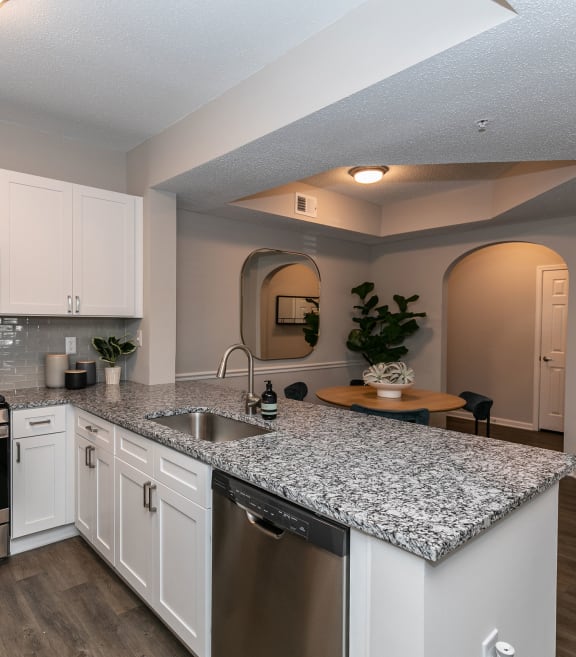a kitchen with granite counter tops and stainless steel appliances at Willowest in Lindbergh in Atlanta, Georgia