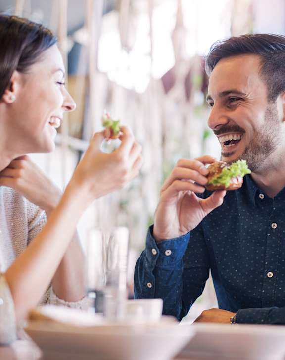 A group of people enjoying a meal together at a table.