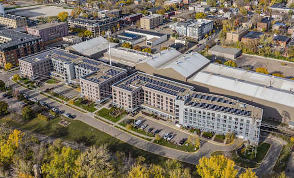 an aerial view of a city with buildings and trees