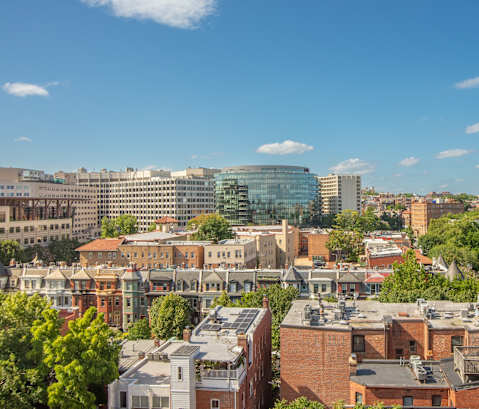 an aerial view of a city with buildings and trees