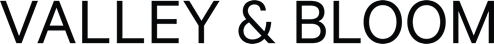 A black background with white letters spelling out "VALLEY & BLOOM".