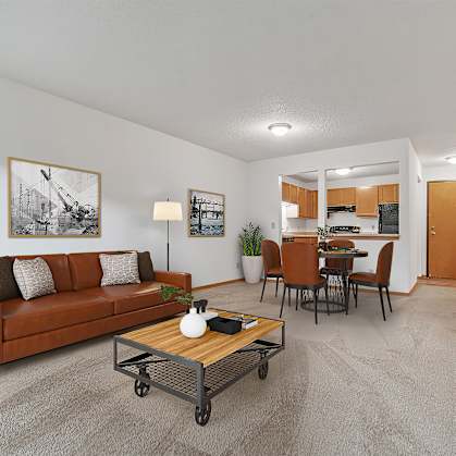 the living room of an apartment with a couch and a coffee table