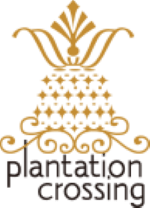 A black and gold logo for plantation crossing.