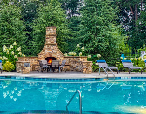 Oaks at Johns Creek - Poolside fireplace
