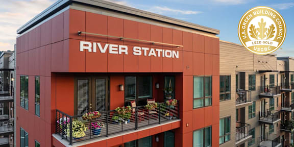 A building with the name River Station on it.