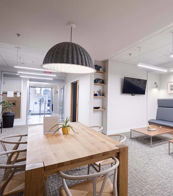 a seating area in a room with a table and chairs