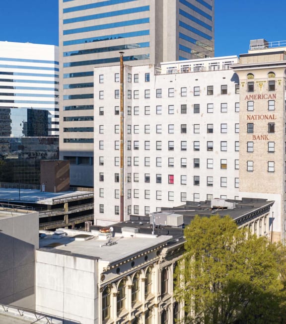 an aerial view of a white building in the city