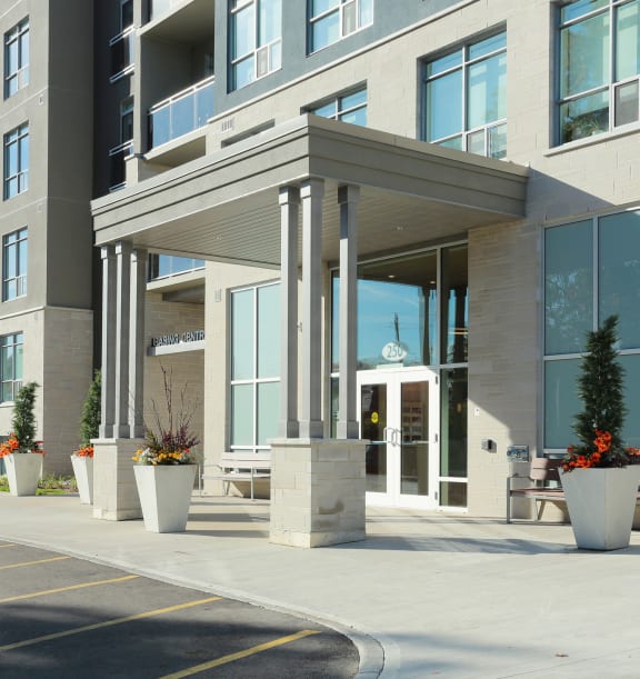 a large apartment building with a parking lot in front of it
