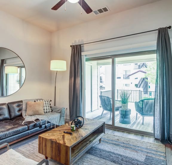 a living room with a sliding glass door to a patio