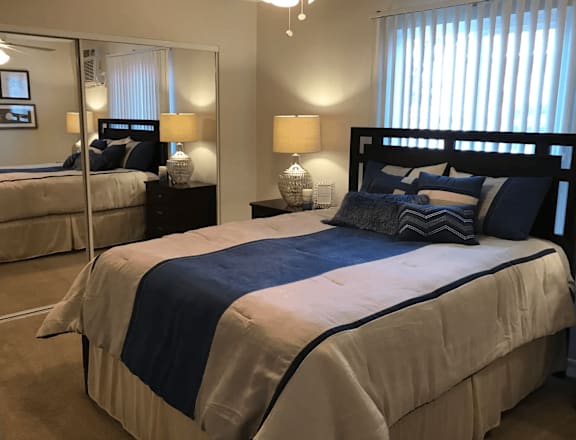 a bedroom with a large bed in a room