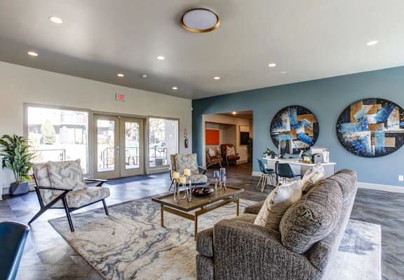a living room with couches and chairs and a table