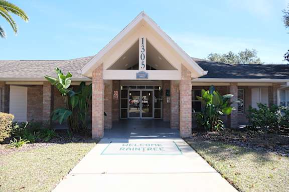 A basketball court with a blue hoop and white lines.